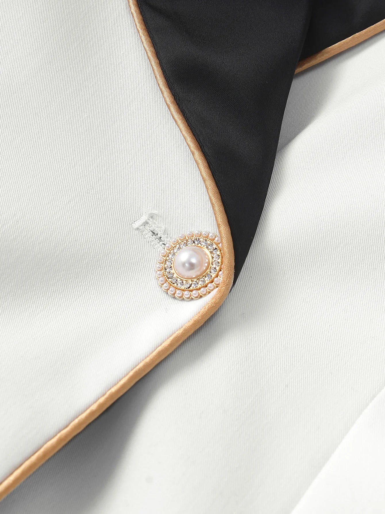 Elegant Asymmetrical White Blazer with Black Contrast Lapels
